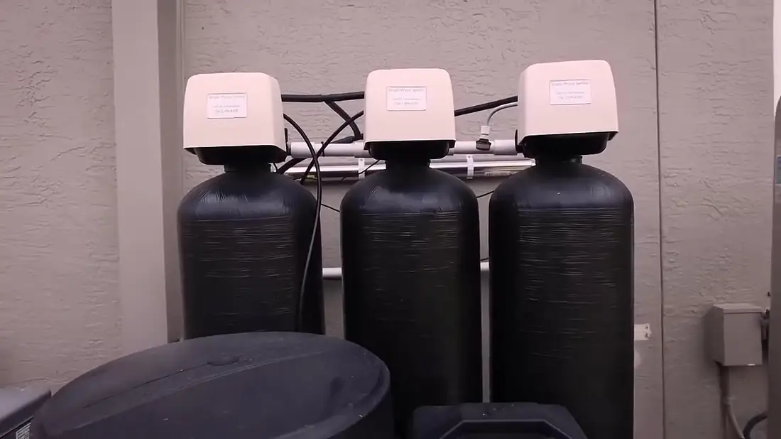 Three-tank Simple Water Service whole-home water treatment system with labeled control heads