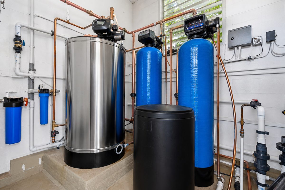 Commercial central water softening and filtration system installed in a condo property mechanical room