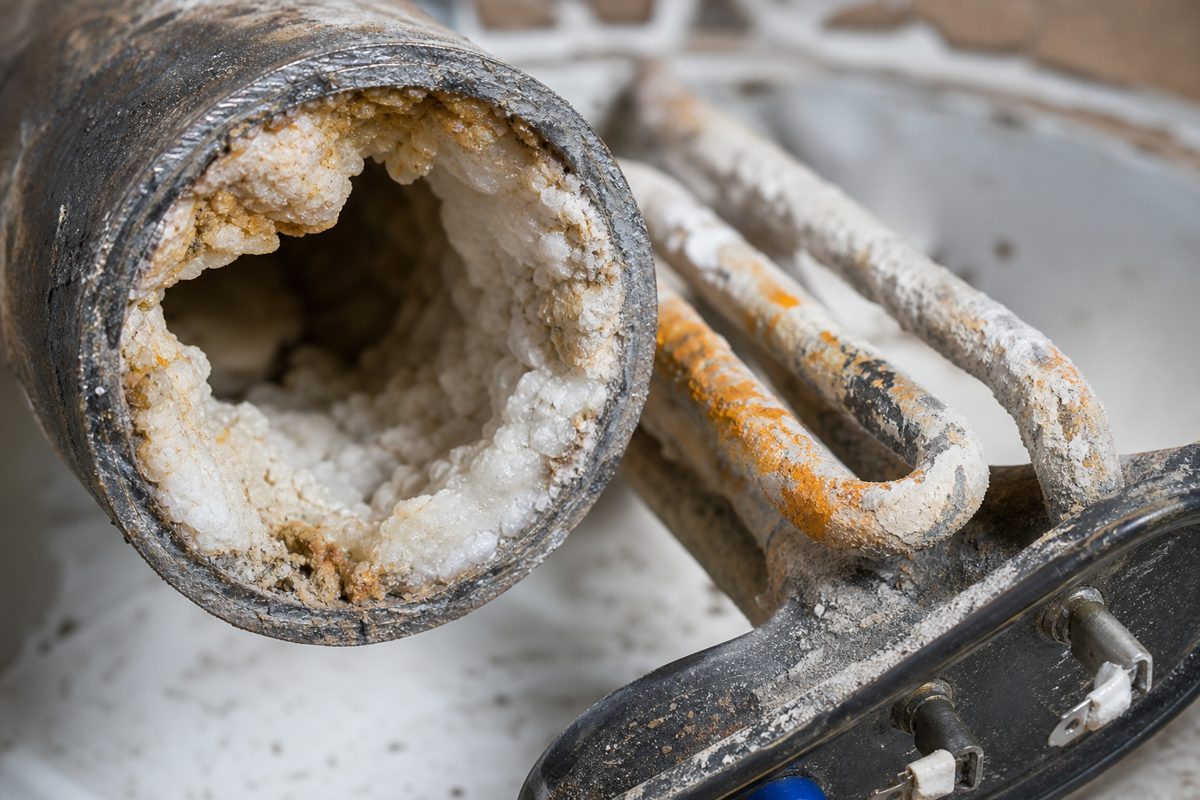 Scale buildup inside commercial water equipment caused by untreated hard water